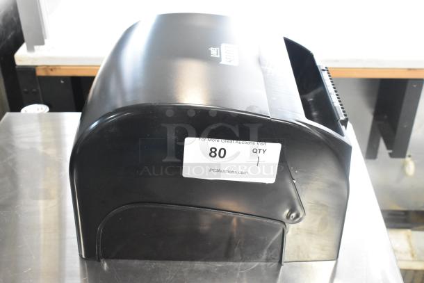 Lavex Select black poly wall mount paper towel dispenser, in good condition, with label showing auction details.