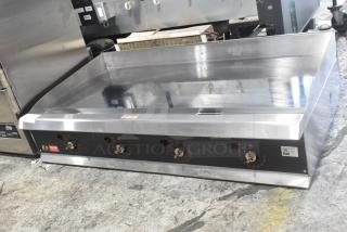 BRAND NEW Commercial Countertop Propane Griddle by Cooking Performance Group, model 351GTUCPG48L, stainless steel, 120,000 BTU.