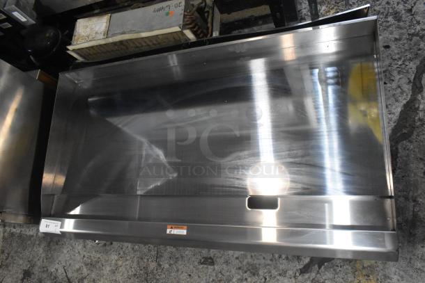 Brand new Cooking Performance Group stainless steel propane griddle, model 351GTUCPG48L, minor scratches, 120,000 BTU.