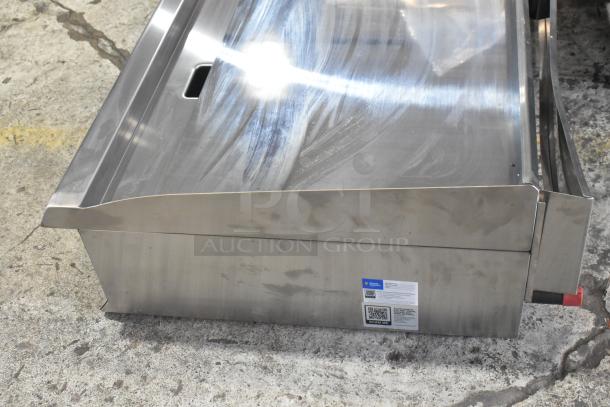 Brand new Cooking Performance Group CPG 351GTUCPG48L stainless steel griddle, chrome top, propane, 120,000 BTU, with labels.