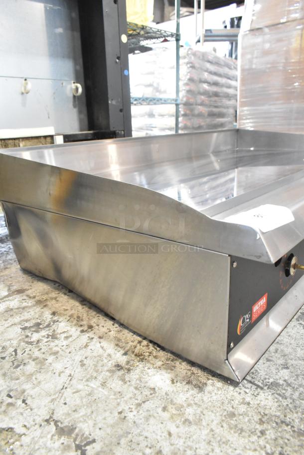 Brand new Cooking Performance Group 351GTUCPG48L stainless steel griddle. Propane gas powered, 120,000 BTU. Chrome top with minor scratches.