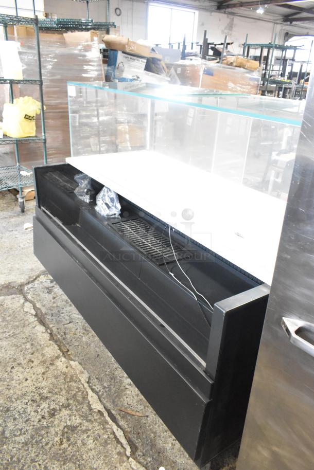 Metal commercial horizontal open grab 'n' go merchandiser with top display case, features a sleek black finish and spacious interior.