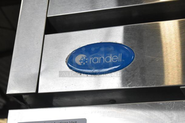 Randell R1F-29-1 stainless steel commercial single door reach-in freezer, features blue Randell logo, on casters.