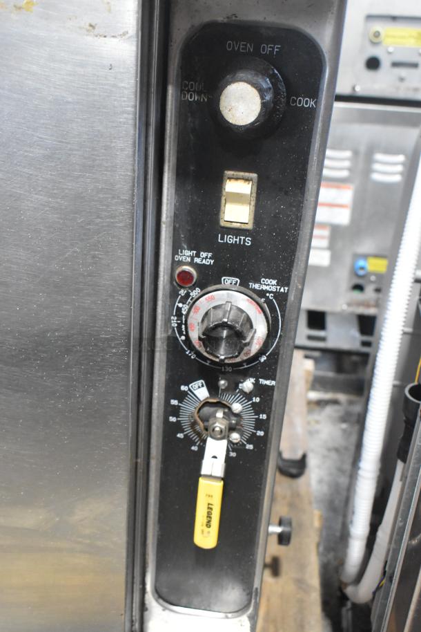 Blodgett stainless steel commercial convection oven, solid doors, metal racks, thermostatic controls, and metal legs shown.