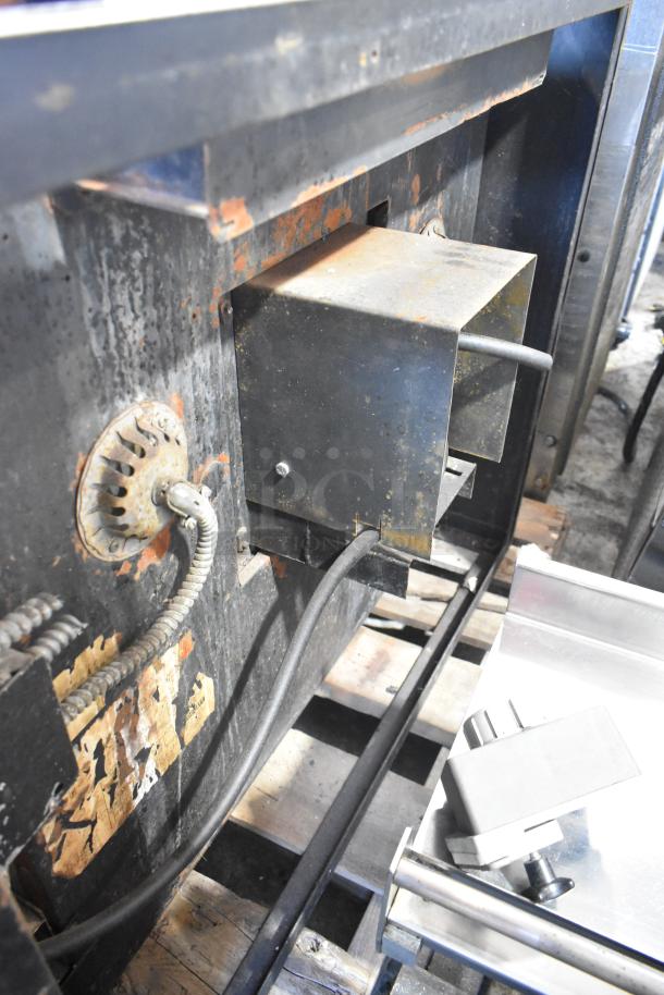 Blodgett stainless steel convection oven showing back panel, thermostatic controls, metal racks, and signs of wear.