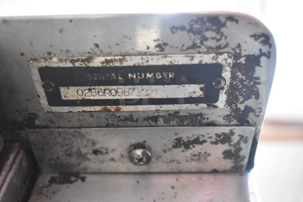 Blodgett convection oven serial number plate showing "SERIAL NUMBER 0286R098702" on a worn, rusted metal surface.
