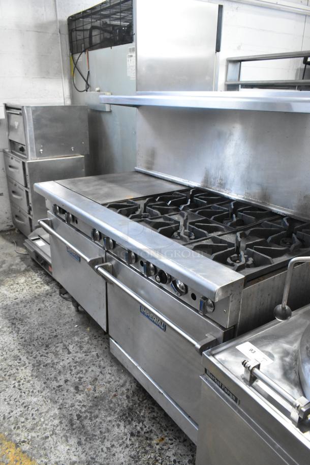 Imperial stainless steel commercial 6-burner range with griddle, convection oven, and backsplash. Includes over shelf.