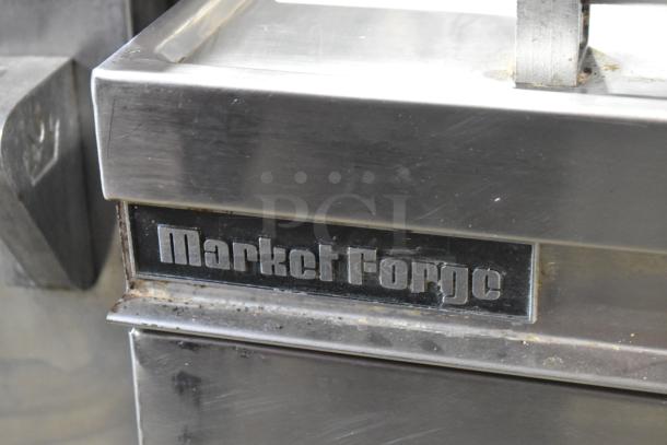 Market Forge MT40 stainless steel commercial steam kettle, 40-gallon, floor style. Model MT40 visible with brand logo.