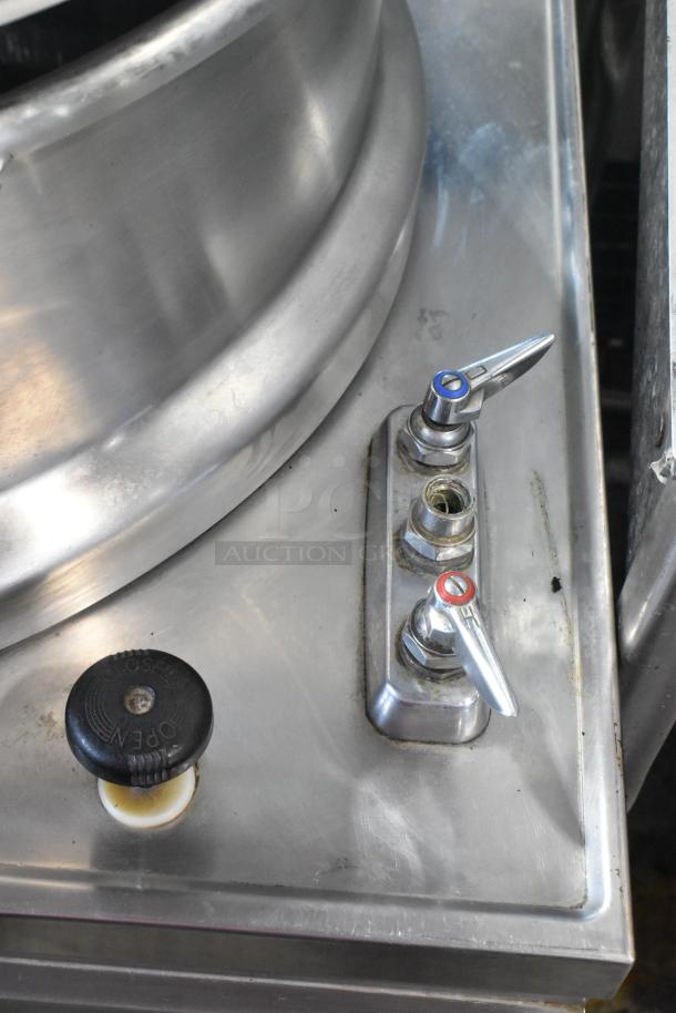 Market Forge MT40 stainless steel 40-gallon steam kettle, floor style, features temperature and control valves.