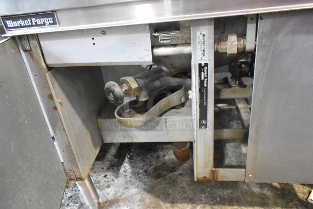 Market Forge MT40 40-gallon stainless steel steam kettle, commercial floor style, visible wear, brand label present.