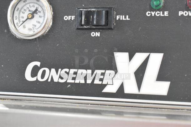 Jackson Conserver XL stainless steel commercial dishwasher control panel. Features on/off switch, temperature gauge. Model name visible.