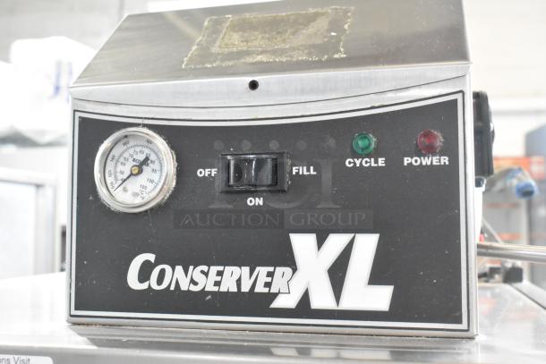 Jackson Conserver XL stainless steel commercial dishwasher, pass-through design, 115V, 1 phase, with controls and temperature gauge.