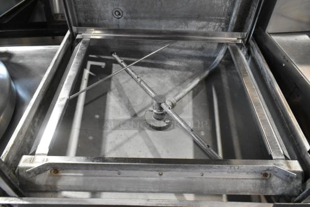 Jackson Conserver XL Stainless Steel Commercial Pass Through Dishwasher, 115 Volts, 1 Phase, visible cleaning arms inside.