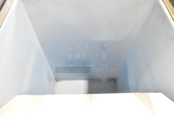 Stainless steel commercial ice bin, spacious interior, white finish, clean condition, ideal for restaurant use.