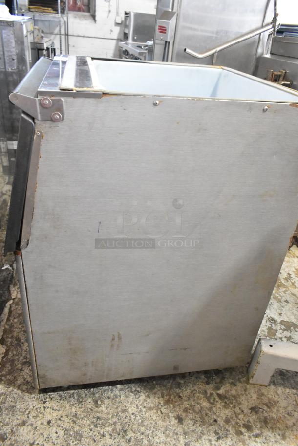 Stainless Steel Commercial Ice Bin; durable, spacious, used condition with slight wear. Ideal for kitchens or bars.
