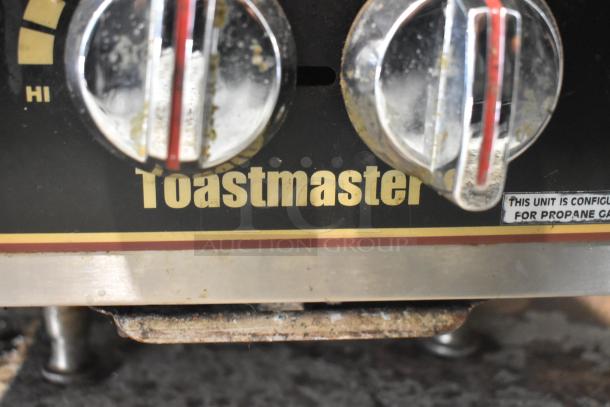 Toastmaster TMDO-12 stainless steel 2 burner propane range, showing control knobs and propane gas label. Used condition.