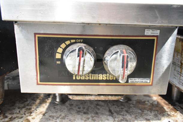 Toastmaster TMDO-12 2 Burner Range, stainless steel, propane gas, used condition. Control panel with model label visible.