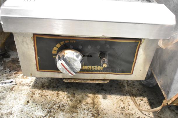 Toastmaster TMDO-12 stainless steel 2-burner range with control panel, signs of wear, commercial propane gas powered.