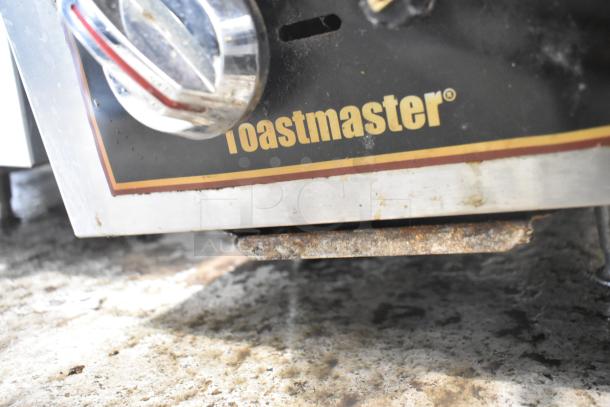 Toastmaster TMDO-12 stainless steel commercial 2 burner range, propane gas powered, visible wear and rust.