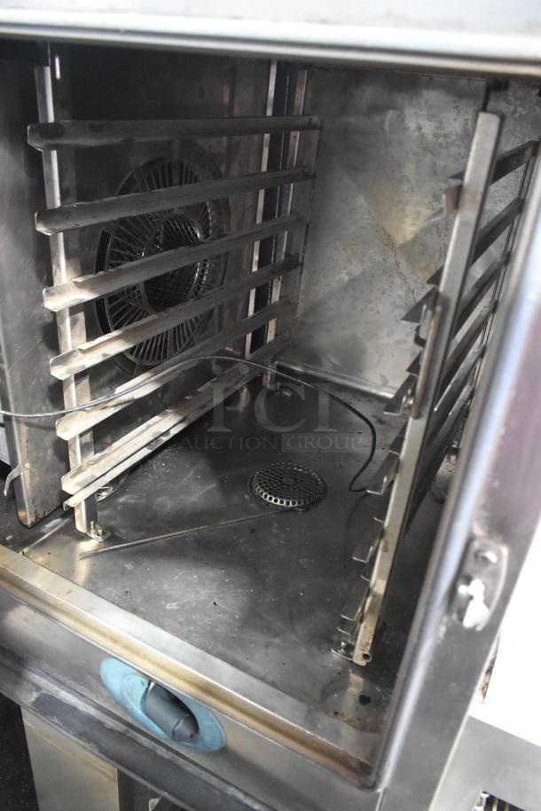 Rational SelfCooking Center combi convection oven interior, stainless steel with double pan rack, commercial casters.