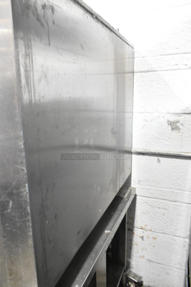 Stainless steel Rational SelfCooking Center Combi Oven with double pan rack and commercial casters, showing slight wear.