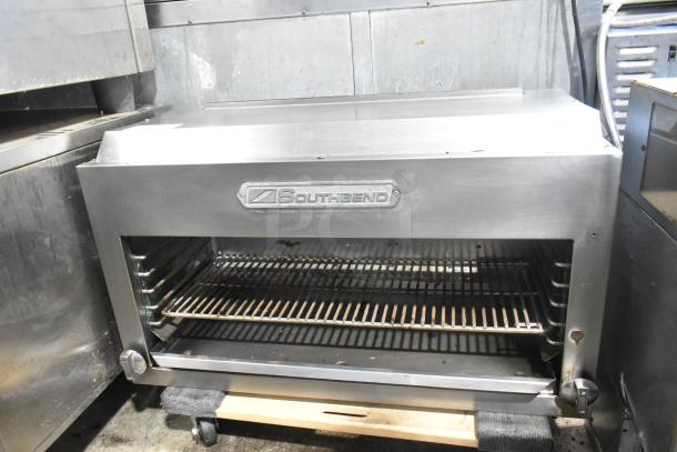 Southbend stainless steel commercial cheese melter, features adjustable grilling racks, visible brand logo, in used condition.