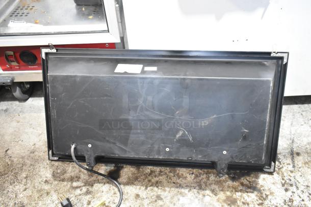 Black open sign, 115 volts, 1 phase. Visible wear, cable attached. Suitable for storefront display.