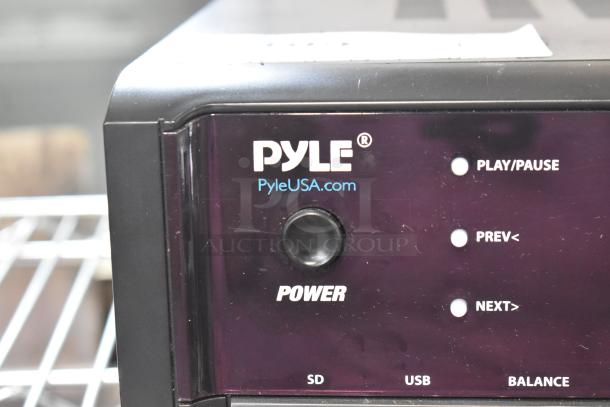 Pyle PT390BTU Bluetooth stereo receiver, black, shows power button, play/pause controls, and ports for SD, USB, balance.