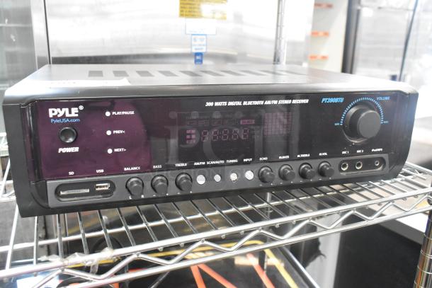 Pyle PT390BTU Bluetooth stereo receiver, 300 watts, with digital display and multiple input options. Appears in good condition.