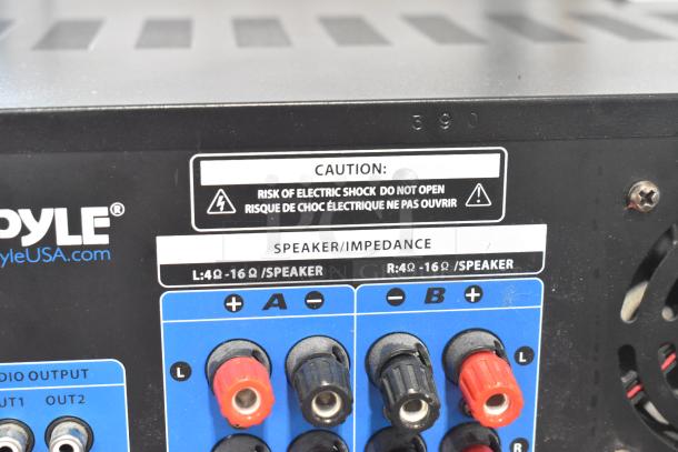 Pyle PT390BTU Bluetooth stereo receiver rear panel with speaker connections and caution label.