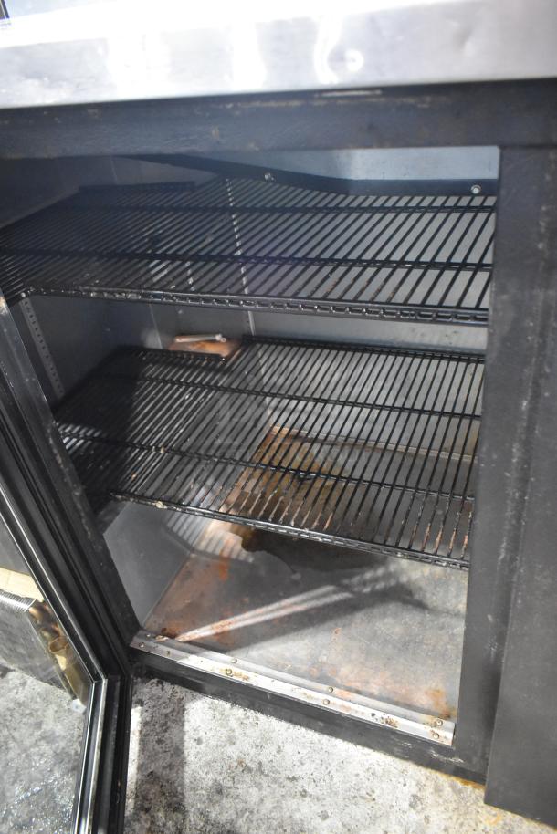 2017 True TBB-4G-LD metal 3-door back bar cooler, merchandiser, shelves visible, 115V, 1 phase, used condition.