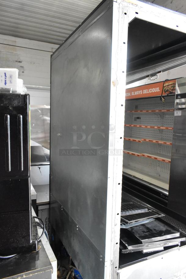 Master-Bilt commercial open merchandiser missing one side panel, metal construction, shelves visible inside.
