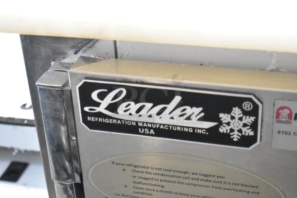 2018 Leader LM48 S/C stainless steel prep table label, showing brand logo and maintenance instructions.
