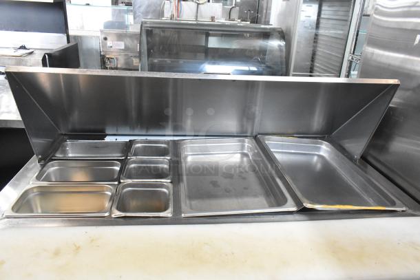 2018 Leader LM48 S/C stainless steel prep table; salad and sandwich station with compartments. Commercial casters, 115V.