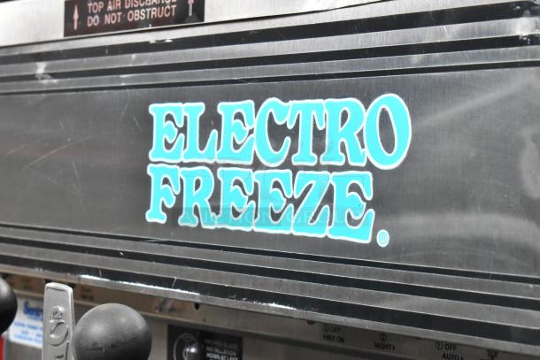 Electro Freeze 88T-CMT-113 stainless steel soft serve ice cream machine, 2 flavor with twist, on commercial casters.
