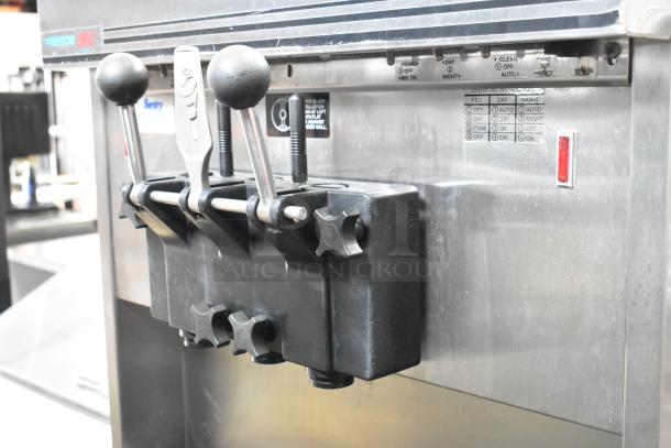 Electro Freeze 88T-CMT-113 soft serve machine, stainless steel, 2-flavor with twist, water-cooled, commercial casters.