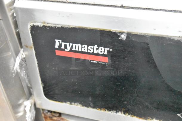 Frymaster GF14SP commercial propane fryer, metal construction, 100,000 BTU, visible wear on label, floor style.
