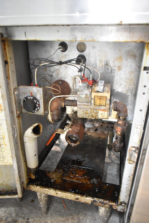 Frymaster GF14SP propane gas fryer, floor model. Rust visible, operational dials and wiring exposed. 100,000 BTU.
