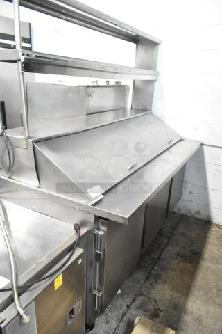 Beverage Air SP72-30M stainless steel commercial sandwich salad prep table with 2-tier overshelf, on commercial casters.