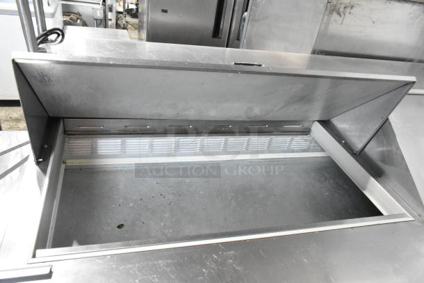Beverage Air SP72-30M stainless steel prep table with open top, over shelf, and commercial casters. Model shows light wear.