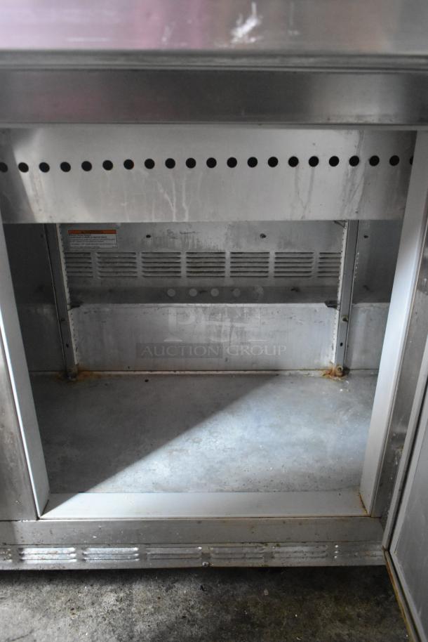Beverage Air SP72-30M stainless steel prep table, used condition, features two-tier shelf, commercial casters, and 115V power.