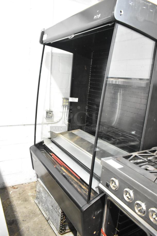Master-Bilt metal commercial reach-in grab-n-go merchandiser in used condition, with glass front and shelves, suitable for retail.