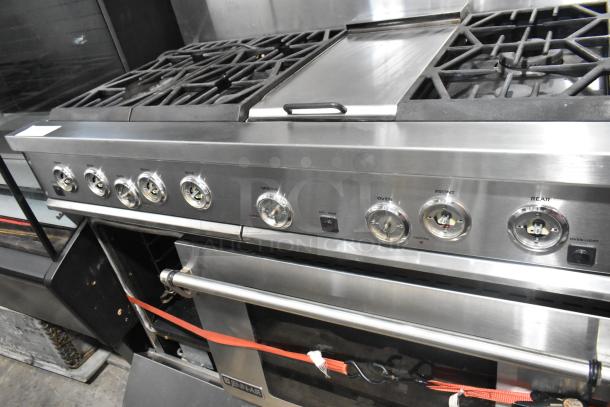 Jenn-Air stainless steel commercial 6 burner range with oven, over shelf, and backsplash in good condition.
