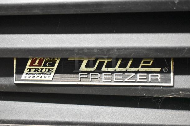 True GDM-49F metal freezer label; commercial reach-in model with poly-coated racks. 115/208-230V, 1 phase.