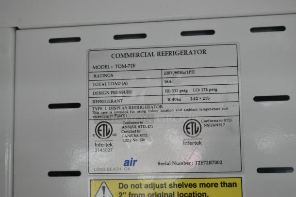 Turbo Air TOM-72E commercial merchandiser label, 220V, 1 Phase, R-404a refrigerant, metal shelves, model and ratings details.