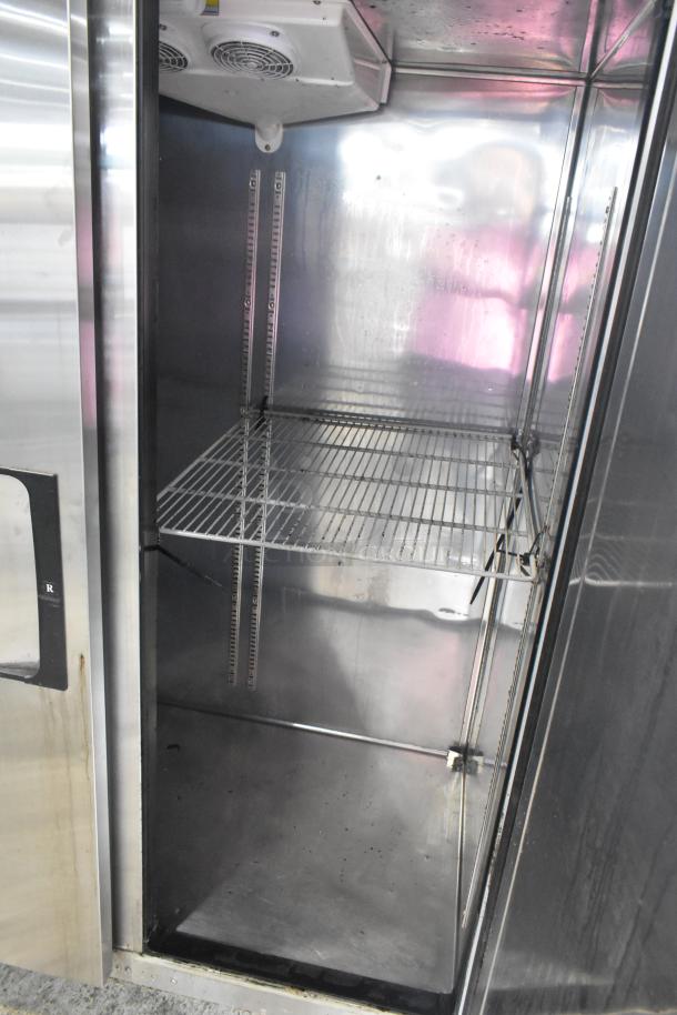 Everest ESR2 stainless steel 2-door reach-in cooler, poly-coated rack, commercial casters, 115 volts, 1 phase, interior view.