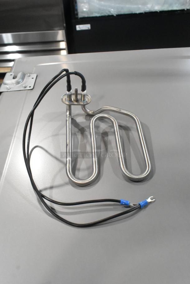 Brand new Blodgett 55127 safety valve, 1/4 inch, with burner; metallic, coiled design, black wires attached.