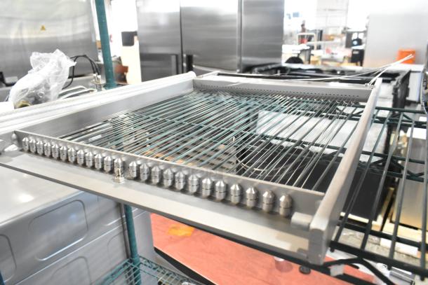 Brand new industrial cutter with minor scratches and dents. Features durable metal frame and multiple cutting wires.