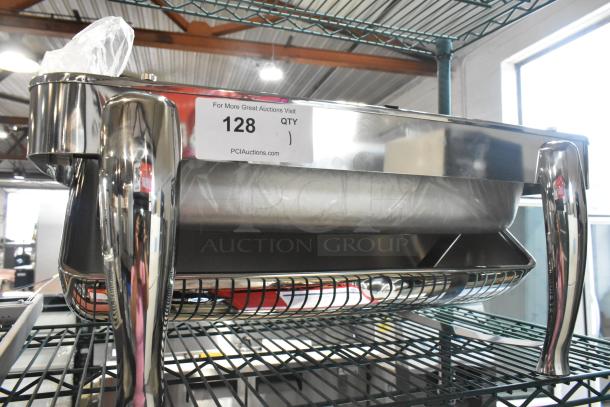 Stainless steel chafing dish, brand new with minor scratches and dents, sleek design, label indicates auction info.