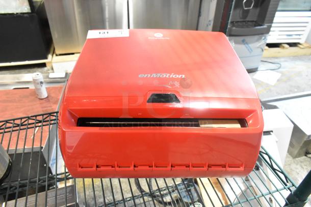 Red Georgia Pacific enMotion wall-mounted paper towel dispenser, new with minor scratches. Features automatic dispensing.